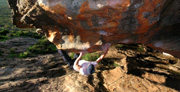 Chris on Wimmelfriedhoff, V5 at Hollow Mountain cave.