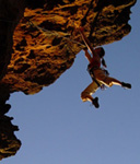 Jacqui Middleton pops the dyno at the end of the roof section of Stepping on Snakes (23), Sentinel Cave, Grampians.