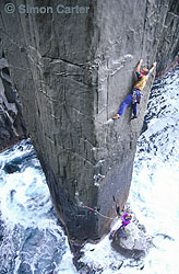Steve Monks leading pitch one of The Free Route (25) during the first free ascent of The Totem Pole, Cape Hauy, Tasman Peninsula, Tasmania, Australia.