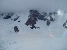 Deteriorating weather moving in. View from Plateau Hut window looking towards Mt Cook and Zubbrigens Ridge.