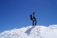 John Kazanas standing on the first part of the Mt Cook ice cap above the summit rocks