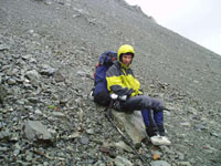 Rained out author resting on easier slopes of the Boys Glacier whilst walking out