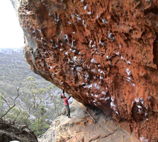 Bouldering the start of Mr Meat, grade 25.